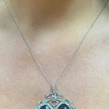 Edwardian Diamond and Onyx Platinum and 18k Yellow Gold Pendant, circa 1900s