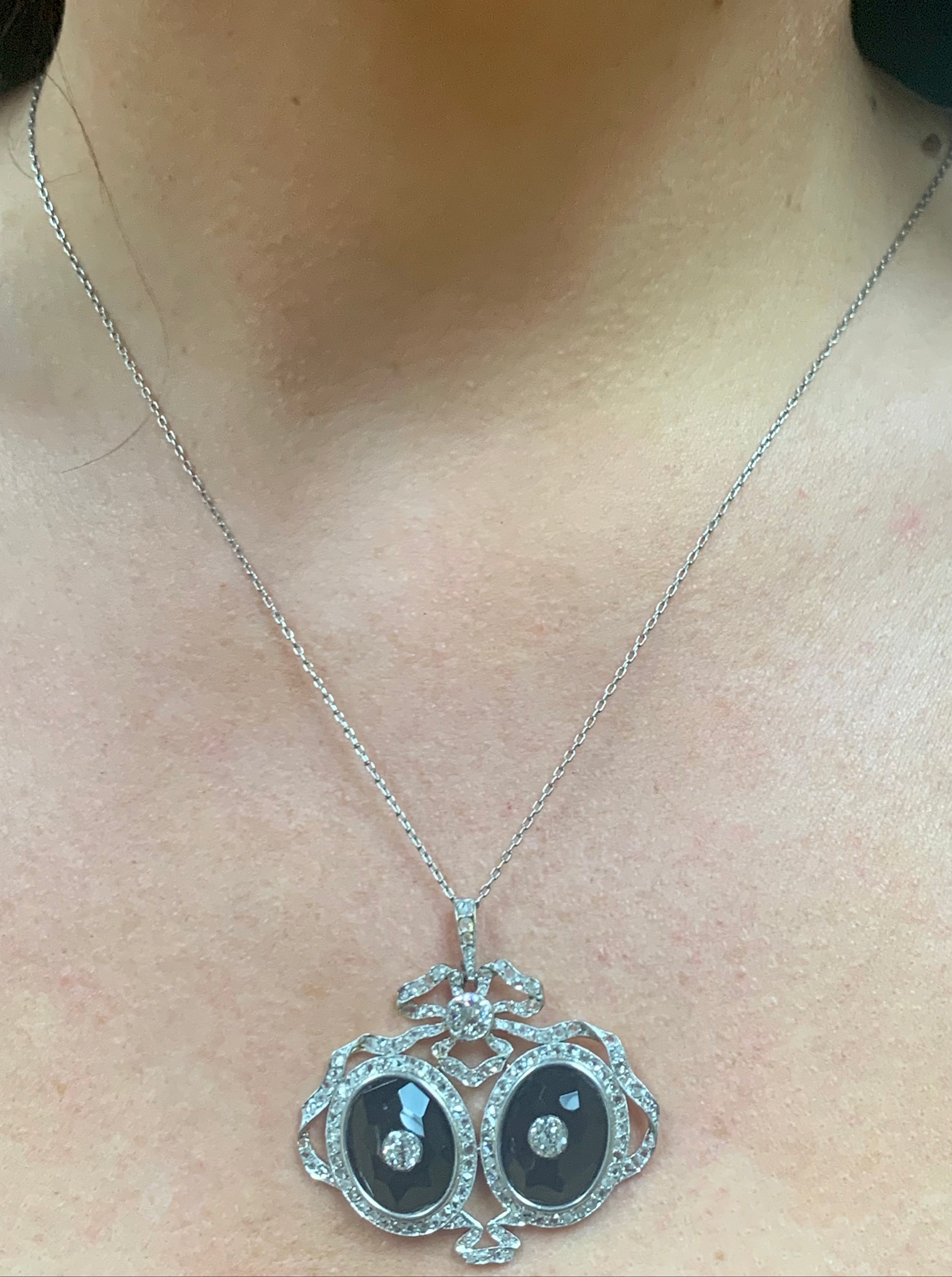 Edwardian Diamond and Onyx Platinum and 18k Yellow Gold Pendant, circa 1900s