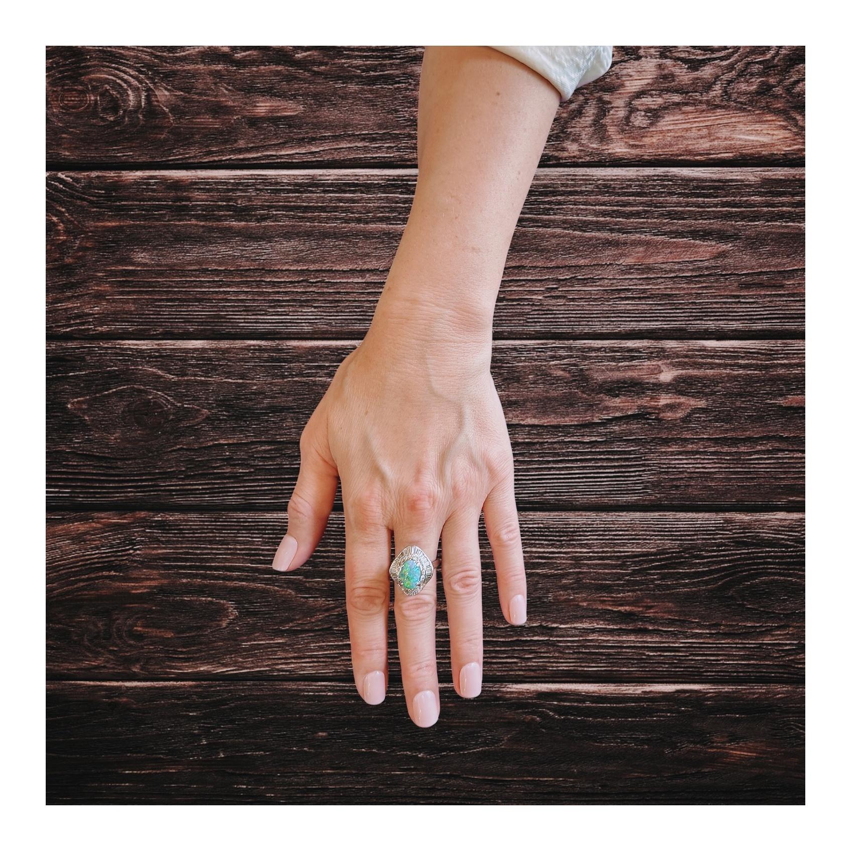 MID-CENTURY PLATINUM BLACK OPAL AND DIAMOND BALLERINA STYLE RING